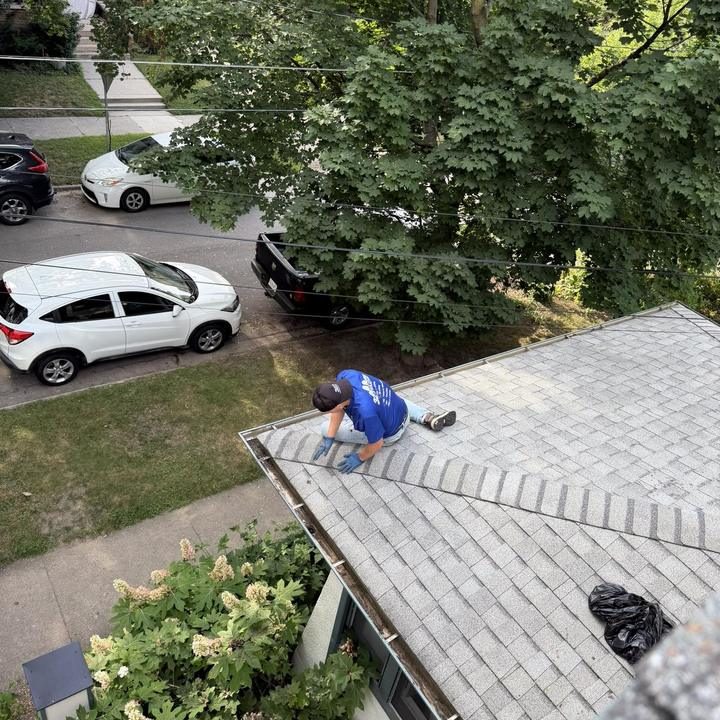 Working along a roofline above the gutter run.