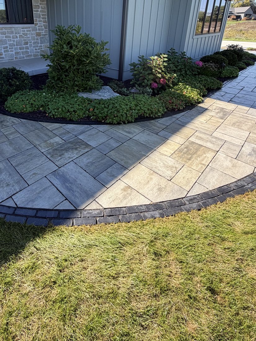 The same walkway after rust treatment, the pavers back to their natural gray and tan.